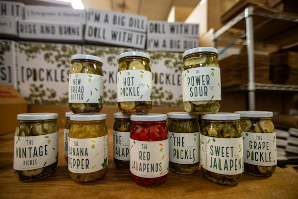A selection of the more than 40 kinds of pickles made at Evergreen & Market's warehouse in Tucker, where Salwa Kisswani labels and ships pickles and manages the business. (Jenni Girtman for the AJC)