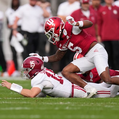 Alabama quarterback Ty Simpson, left, fumbles as he is hit by Indiana defensive back D'Angelo Ponds (5) during the first half of the Rose Bowl College Football Playoff quarterfinal game Thursday, Jan. 1, 2026, in Pasadena, Calif. (AP Photo/Mark J. Terrill)