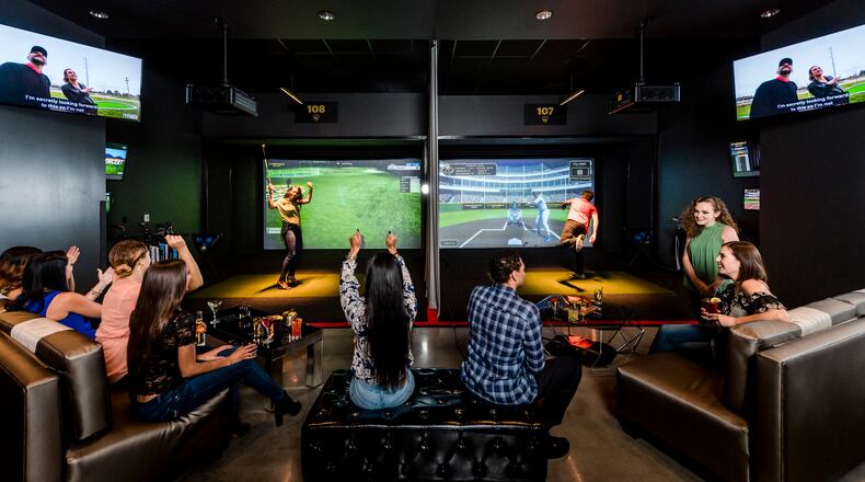 The Topgolf Swing Suite bays offer a variety of virtual games – including the popular Topgolf target game, zombie dodgeball, hockey shots, baseball pitching, carnival classic and more. Credit: Delaware North