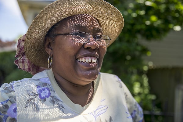Sandra Gordon smiles for a portrait at her home in Atlanta’s Old Fourth Ward community. “I’d hate to move,” said Gordon. “But if I have to, I have to.” (ALYSSA POINTER/ALYSSA.POINTER@AJC.COM)