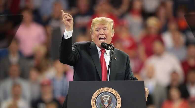 President Donald Trump speaks to supporters during a campaign rally at the Amsoil Arena Duluth, Minn., on Wednesday. Scott Olson/Getty Images