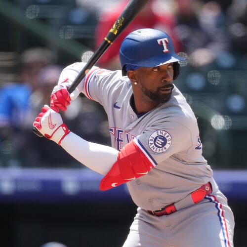 FILE - Texas Rangers designated hitter Andrew McCutchen (4) in the fith inning of a baseball game May 20, 2026, in Denver. (AP Photo/David Zalubowski, File)