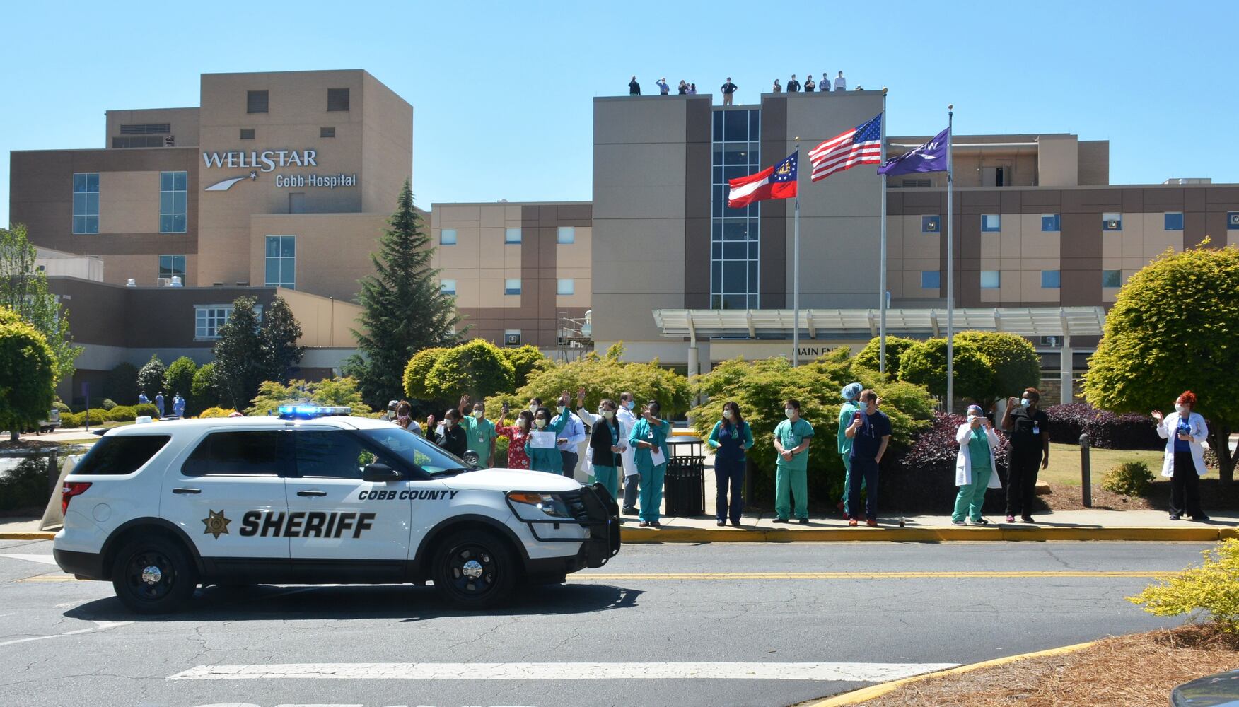 Cobb sheriff’s deputies form parade to honor frontline healthcare workers