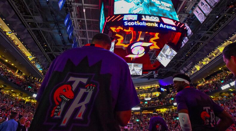 Members of the Toronto Raptors pause for a moment of silence during a tribute to Kobe Bryant ahead of the team's NBA basketball game against the Atlanta Hawks on Tuesday, Jan. 28, 2020, in Toronto. (Frank Gunn/The Canadian Press via AP)