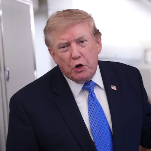 President Donald Trump speaks to reporters onboard Air Force One while returning to the White House, Sunday, Aug. 2, 2026. (AP Photo/Jacquelyn Martin)