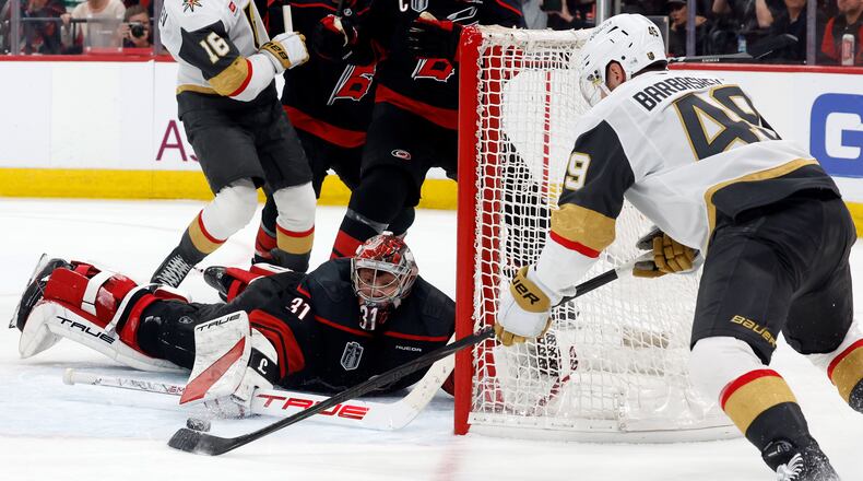 Carolina Hurricanes goaltender Frederik Andersen (31) stops a shot byf Vegas Golden Knights' Ivan Barbashev (49) during the third period in Game 2 of the NHL hockey Stanley Cup Final series in Raleigh, N.C., Thursday, June 4, 2026. (AP Photo/Karl DeBlaker)