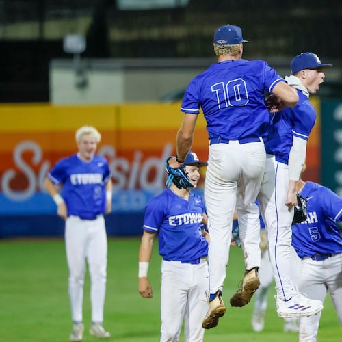 Etowah Eagles pitcher Matthew Sharman and Etowah Eagles center fielder Trevor Condon celebrate with teammates after defeating North Paulding 2-1 during Game 1 of the Class 6A GHSA baseball finals at Gwinnett Field on Tuesday, May 26, 2026, in Lawrenceville, Ga. (Miguel Martinez/AJC)