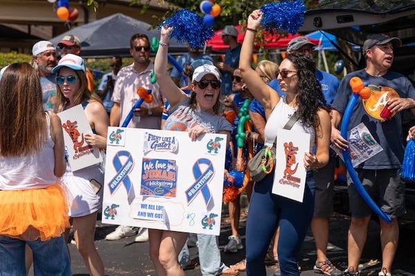 Friends and family decked out in Florida’s orange and blue show their support for Jonah during a surprise event. Even lifelong Georgia fans donned the closest thing they had to Gator attire. (Courtesy of Steven Dewberry) 