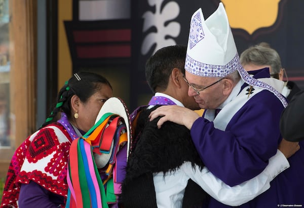FILE - Pope Francis hugs a man in San Cristobal de las Casas, Mexico, Feb. 15, 2016. (L'Osservatore Romano/Pool Photo via AP, File)