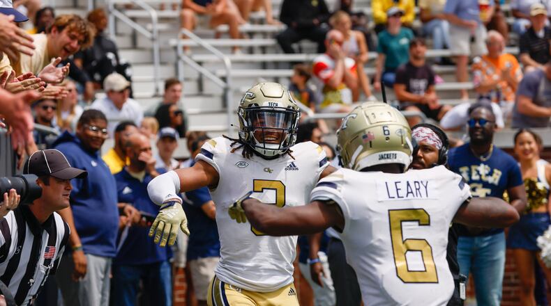 D.J. Moore celebrates his touchdown reception with Christian Leary during Georgia Tech's spring football game in Atlanta on Saturday, April 15, 2023.   (Bob Andres for the Atlanta Journal Constitution)