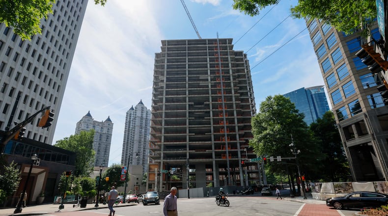 The Campanile building is visible from Peachtree Street NE and 14th Street on Tuesday, May 19, 2026. The well-known Midtown construction site has remained incomplete for years. Local residents are unhappy with the slow progress, and some city officials have taken notice. (Miguel Martinez/AJC)