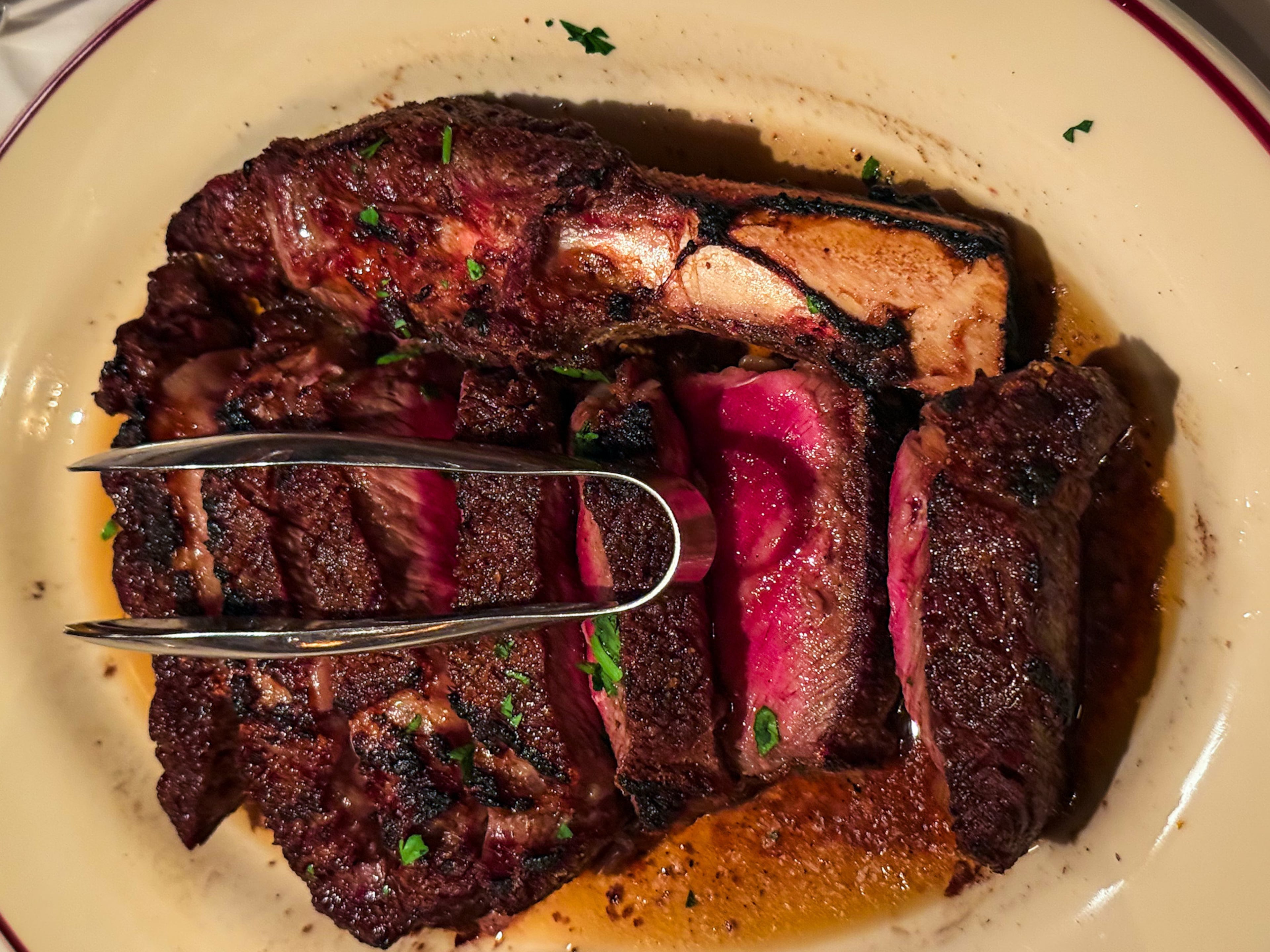 The pace at Bones is neither rushed nor sluggish, so take your time and enjoy the dry-aged cowboy rib-eye for two. (Henri Hollis/AJC)