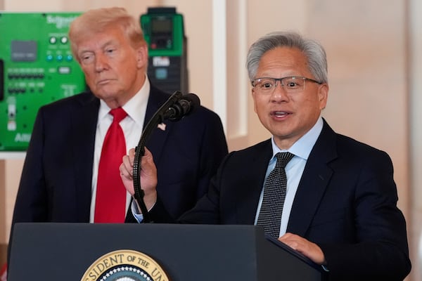 President Donald Trump listens as Nvidia CEO Jensen Huang speaks during an event about investing in America in the Cross Hall of the White House, Wednesday, April 30, 2025, in Washington. (AP Photo/Alex Brandon)