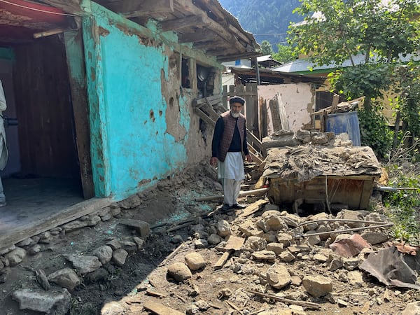 A Kashmiri villager examines damages to his house caused by overnight Indian shelling, in Shah Kot, in Neelum Vallery, a district of Pakistan's administered Kashmir, Saturday, May 10, 2025. (AP Photo/M.D. Mughal)