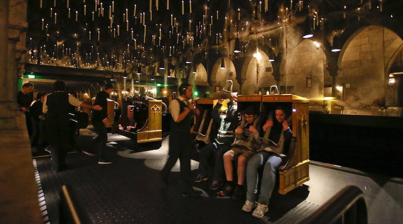 Candlesticks float and hover above the riders aboard Harry Potter and The Forbidden Journey in the new Wizarding World of Harry Potter At Universal Studios Hollywood March 7, 2016. The newly completed attraction bringing J.K. Rowling's Harry Potter stories to life is scheduled to open April 7. (Mark Boster/Los Angeles Times/TNS)