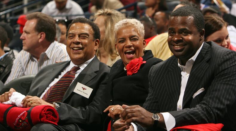 Atlanta's then-mayor Shirley Franklin (center) enjoys the Atlanta Hawks home opener at Philips Arena on November 8, 2005, while seated next to former mayor Andrew Young (left) and then-state-senator Kasim Reed, who served as Franklin's campaign manager. (Brant Sanderlin / AJC file)