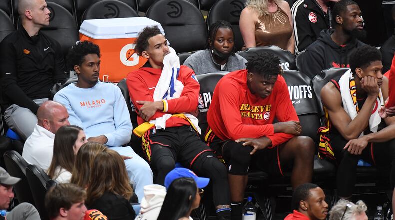 Hawks players react at the end of Game 4 on Sunday night at State Farm Arena. The Heat won 110-86 and lead the best-of-seven series 3-1. (Hyosub Shin / Hyosub.Shin@ajc.com)