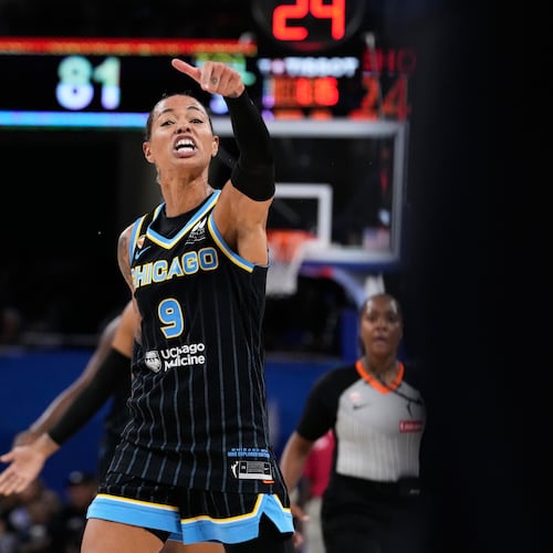 Chicago Sky guard Natasha Cloud argues with former NBA center Enes Kanter Freedom, right, during the second half of a WNBA basketball game against the Indiana Fever, Sunday, Aug. 23, 2026, in Chicago. (AP Photo/Nam Y. Huh)