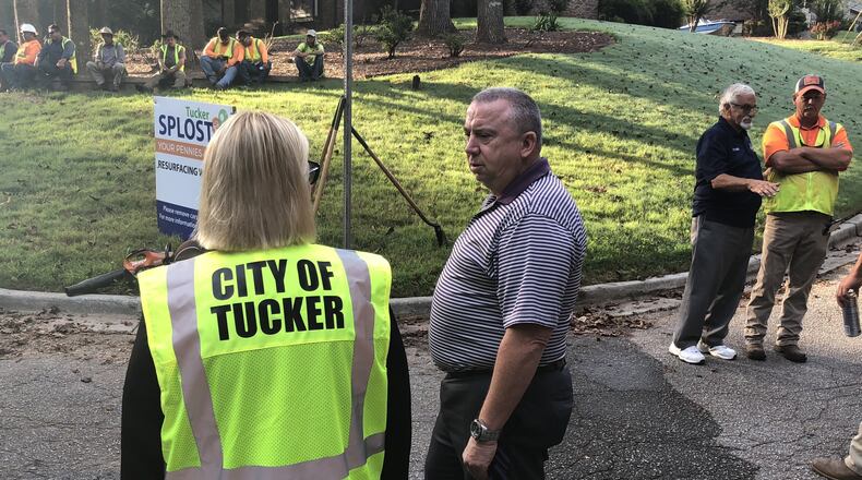 Tucker City Manager Tami Hanlin talks with Parks and Recreation Director Rip Robertson during the August ribbon cutting at the city’s first SPLOST-funded road resurfacing project on Thornridge Lane. Special to AJC.