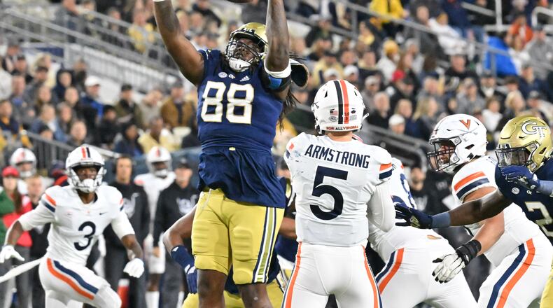 Georgia Tech defensive lineman Zeek Biggers (88) blocks a pass by Virginia quarterback Brennan Armstrong (5) during the first half of a game at Bobby Dodd Stadium in Atlanta on Thursday, October 20, 2022. (Hyosub Shin / Hyosub.Shin@ajc.com)