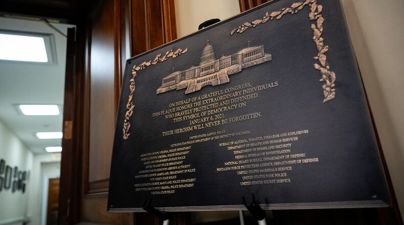A replica plaque commemorating the Jan. 6, 2021 Capitol riot stands outside the office of House Minority Leader Hakeem Jeffries, D-N.Y, Tuesday, Dec. 30, 2025, at the U.S. Capitol in Washington. (AP Photo/Julia Demaree Nikhinson)