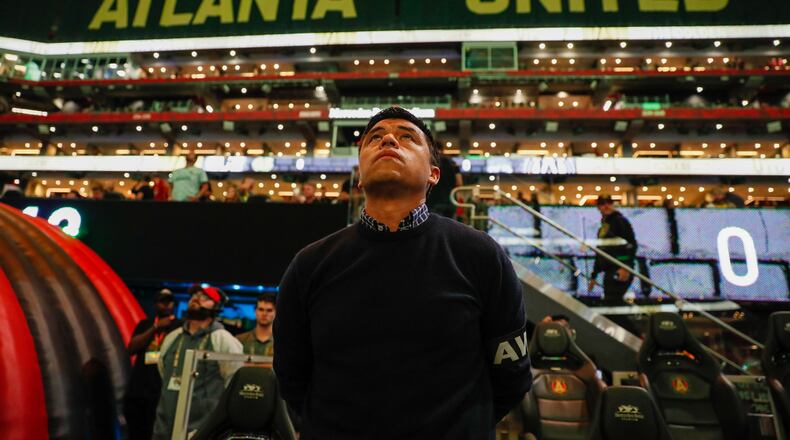 Atlanta United coach Gonzalo Pineda watches the Jumbotron as the team prepares to face the Columbus Crew in Game 2 of a first-round MLS playoff game at Mercedes-Benz Stadium on Tuesday, November 7, 2023. 
 Miguel Martinez / miguel.martinezjimenez@ajc.com