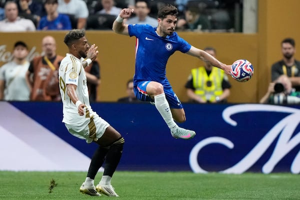 Chelsea's Pedro Neto, right, and Los Angeles FC's Denis Bouanga fight for the ball during the Club World Cup group D soccer match between Chelsea and Los Angeles FC in Atlanta, Monday, June 16, 2025. (AP Photo/Brynn Anderson)