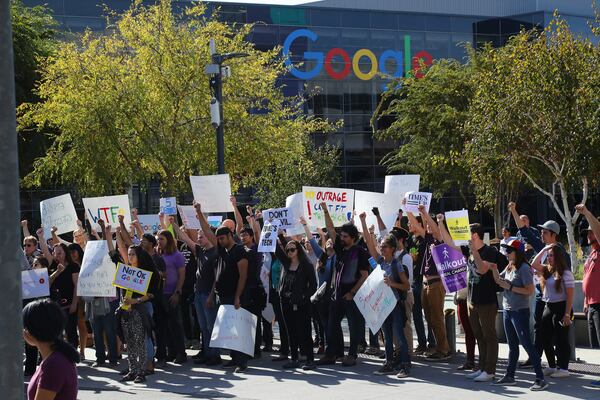 FILE -- Employees stage a walk out to protest how Google handled sexual harassment complaints, outside the company's headquarters in Mountain View, Calif., Nov. 1, 2018. Google’s parent company, Alphabet, has settled a series of shareholder lawsuits over its handling of sexual harassment claims, agreeing to greater oversight and committing to spend $310 million over the next decade on corporate diversity programs. (Jim Wilson/The New York Times)
