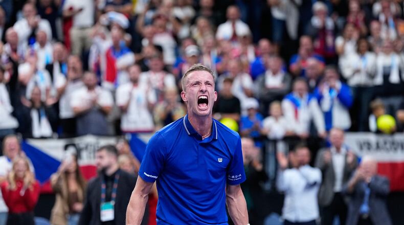 Czechia's Jiri Lehecka celebrates after winning the decisive point against United States' Learner Tien during the Davis Cup second round qualifier match between the Czech Republic and the United States, in Prague, Saturday, Sept. 19, 2026. (AP Photo/Petr David Josek)