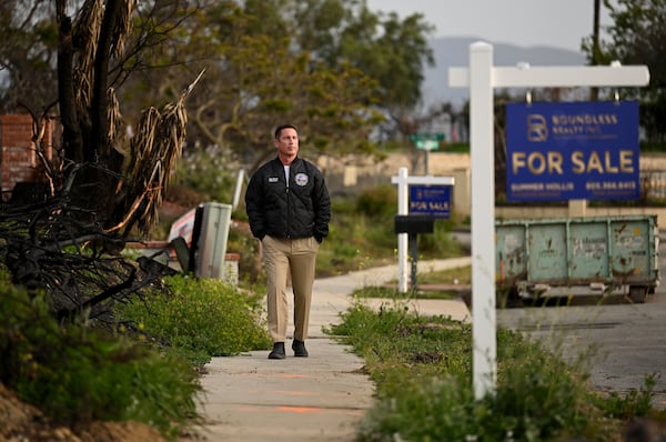 Supervisor Jeff Gorrell walks next to damage from the Mountain Fire along Old Coach Drive in Camarillo Wednesday, April 16, 2025, in Camarillo, Calif. (AP Photo/Wally Skalij)