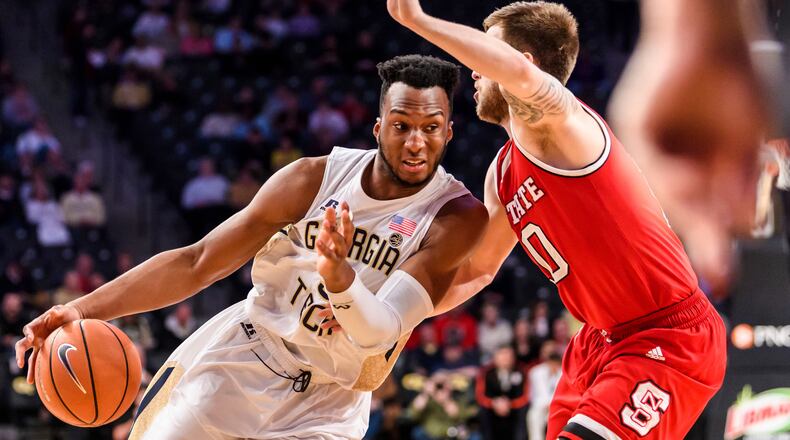 Georgia Tech guard Josh Okogie, left, drives to the basket as North Carolina State guard Braxton Beverly defends on Thursday, March 1, 2018. (AP Photo/Danny Karnik)