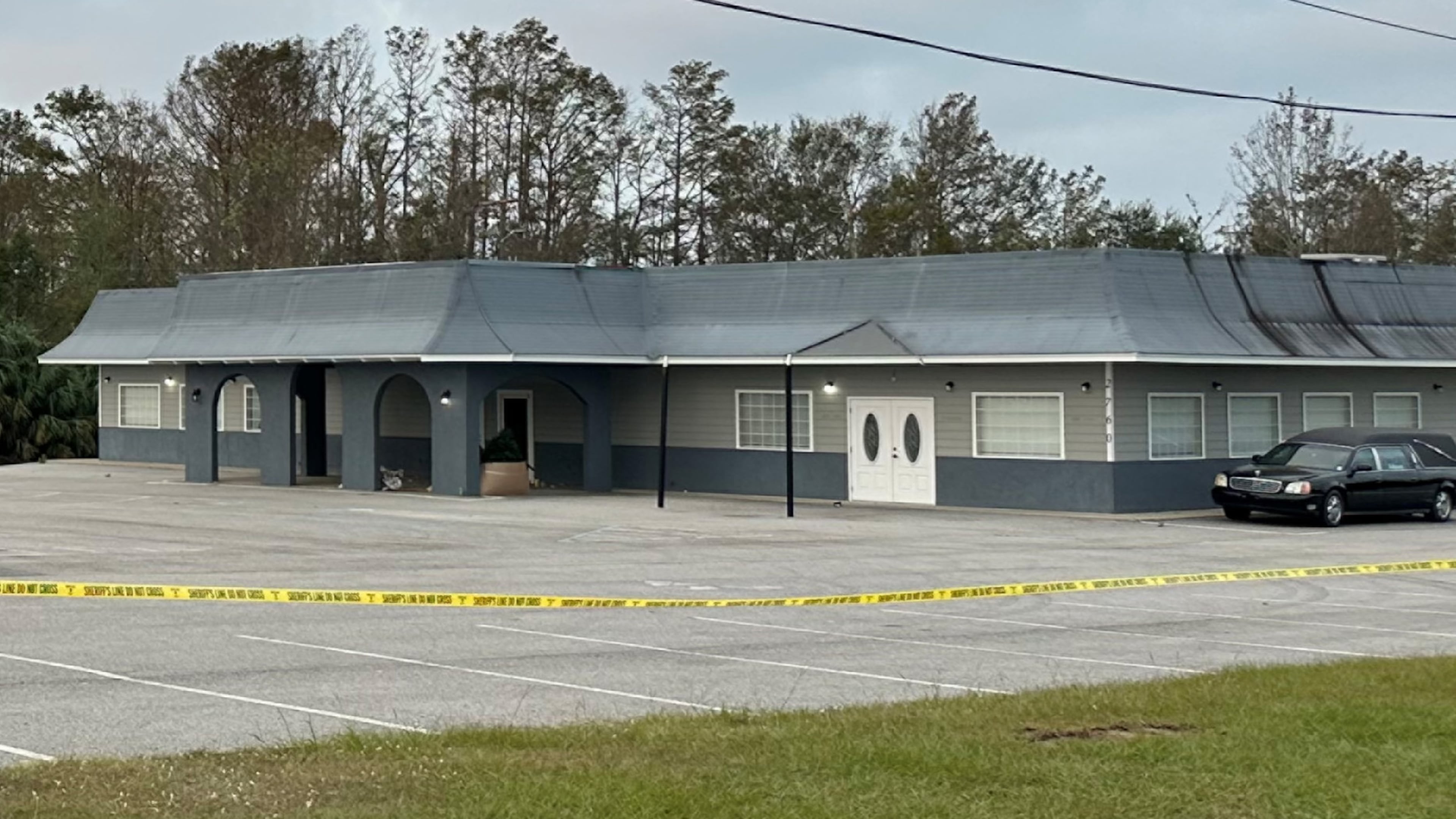 Crime tape surrounds Johnson Funeral & Cremation Services in Coffee County on Monday, Oct. 28, 2024. The GBI on Friday announced 38 new charges against the owner, Chris Lee Johnson. (Kristen Kitchens for the AJC 2024)