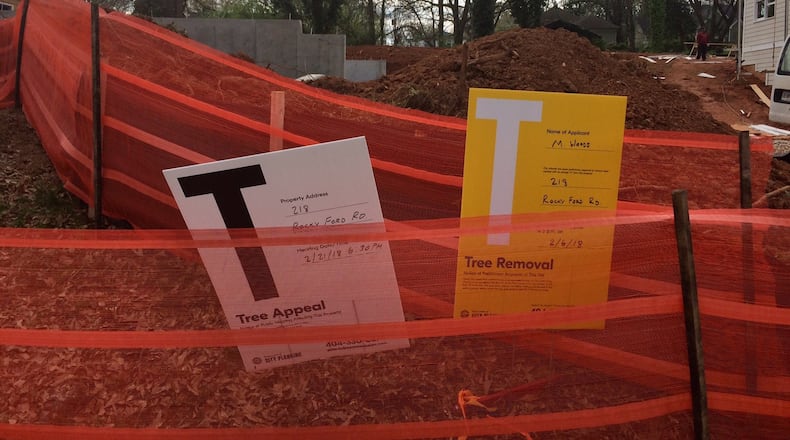 In Atlanta, signs of progress? Or signs of tree carnage? (Bill Torpy/AJC)