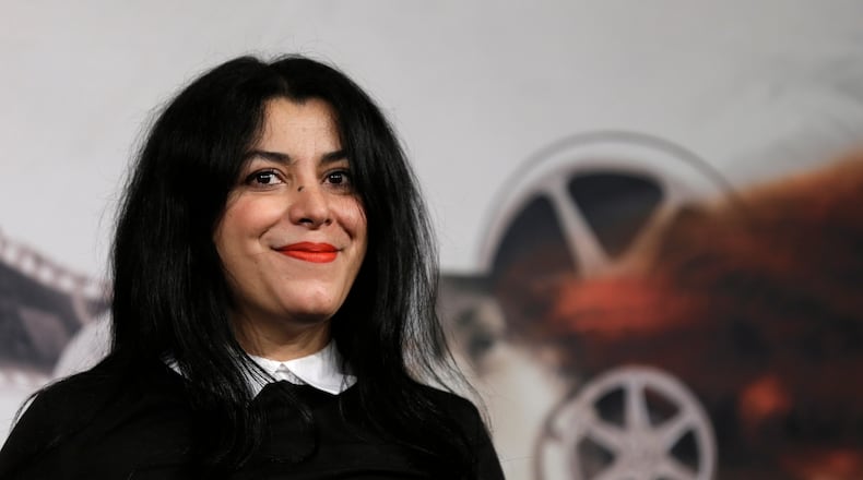 FILE - Director, illustrator and author Marjane Satrapi poses for photographers as she arrives to present the movie "La Bande des Jotas" at the 7th edition of the Rome International Film Festival in Rome, on Nov. 16, 2012. (AP Photo/Alessandra Tarantino, File)