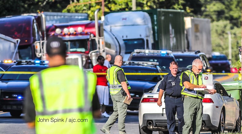 Atlanta police blocked lanes of Donald Lee Hollowell Parkway in northwest Atlanta early Friday morning after a car hit a 14-year-old boy.