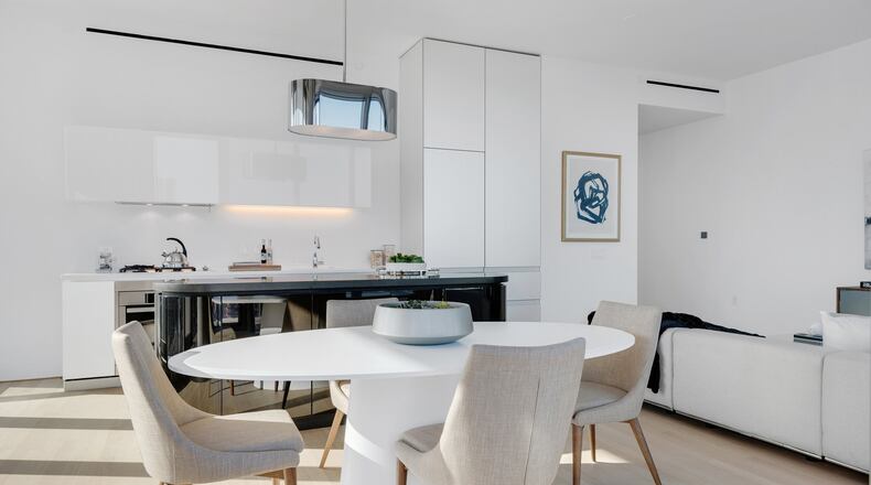 White furniture helps create a monochromatic color palette in this living room. (Design Recipes)