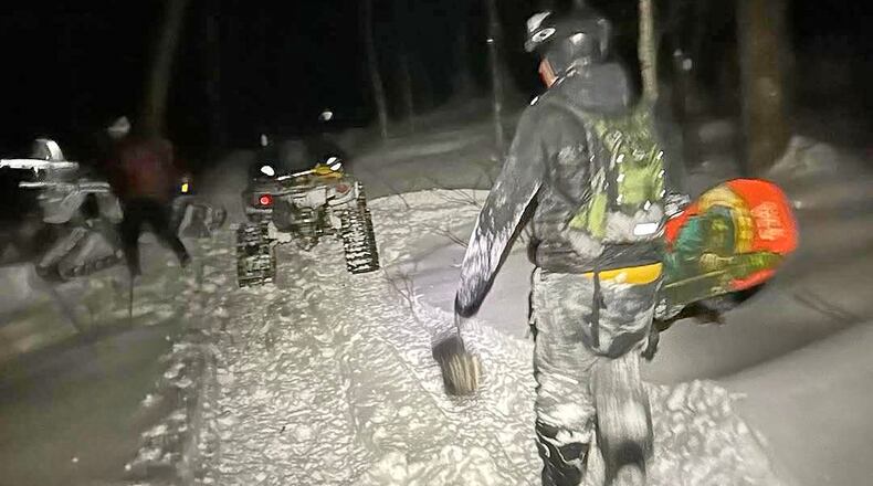 In this photo released by the Stowe Mountain Rescue, Stowe Mountain Rescue responses to a 911 call from a lost skier and snowboarder in the backcountry outside Stowe Mountain Resort on Nov. 29, 2025 in Stowe, Vt. (Stowe Mountain Rescue via AP)