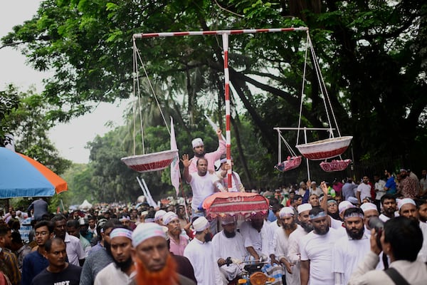 Thousands of supporters of Bangladesh's largest Islamist party Jamaat-e-Islami turn out at a rally in a show of strength ahead of elections expected next year, in Dhaka, Bangladesh, Saturday, July 19, 2025. (AP Photo/Mahmud Hossain Opu)