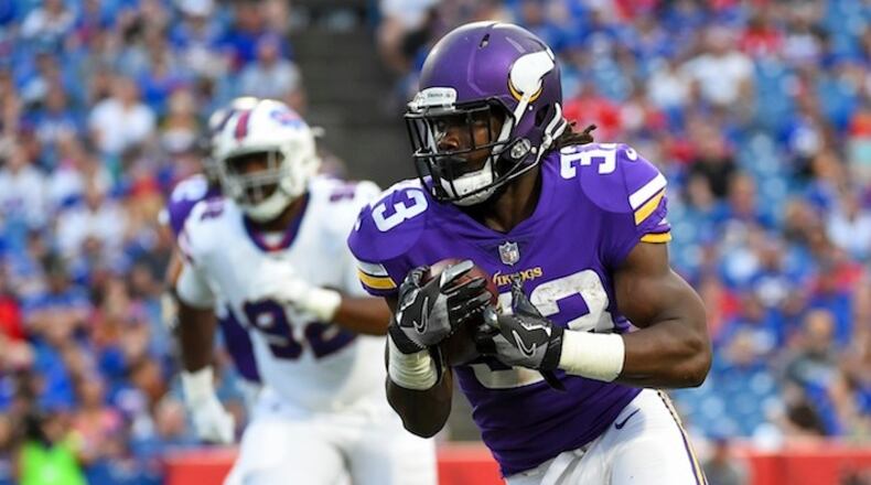 Minnesota Vikings running back Dalvin Cook (33) rushes during the first half of a preseason NFL football game against the Buffalo Bills Thursday, Aug. 10, 2017, in Orchard Park, N.Y. (AP Photo/Rich Barnes)
