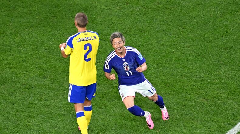 Japan's Daizen Maeda, right, celebrates after scoring their opening goal during the World Cup Group F soccer match between Japan and Sweden in Arlington, Texas, near Dallas, Thursday, June 25, 2026. (AP Photo/Jessica Tobias)