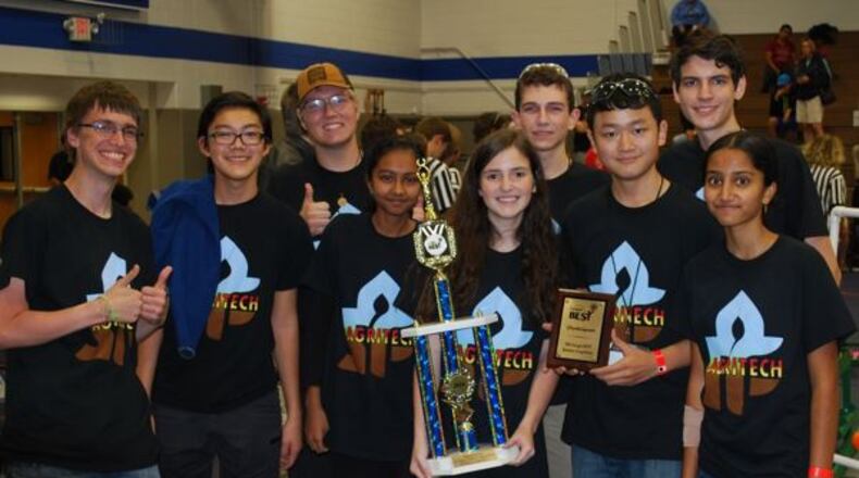 Ryker Hull, Christopher Tan, Jonathan Copeland, Aparna Arul, Rachel Champagne, Matt Ramberger, Dennis Jin, Grant Champagne and Sweta Munagapati pose with the BEST Award trophy.