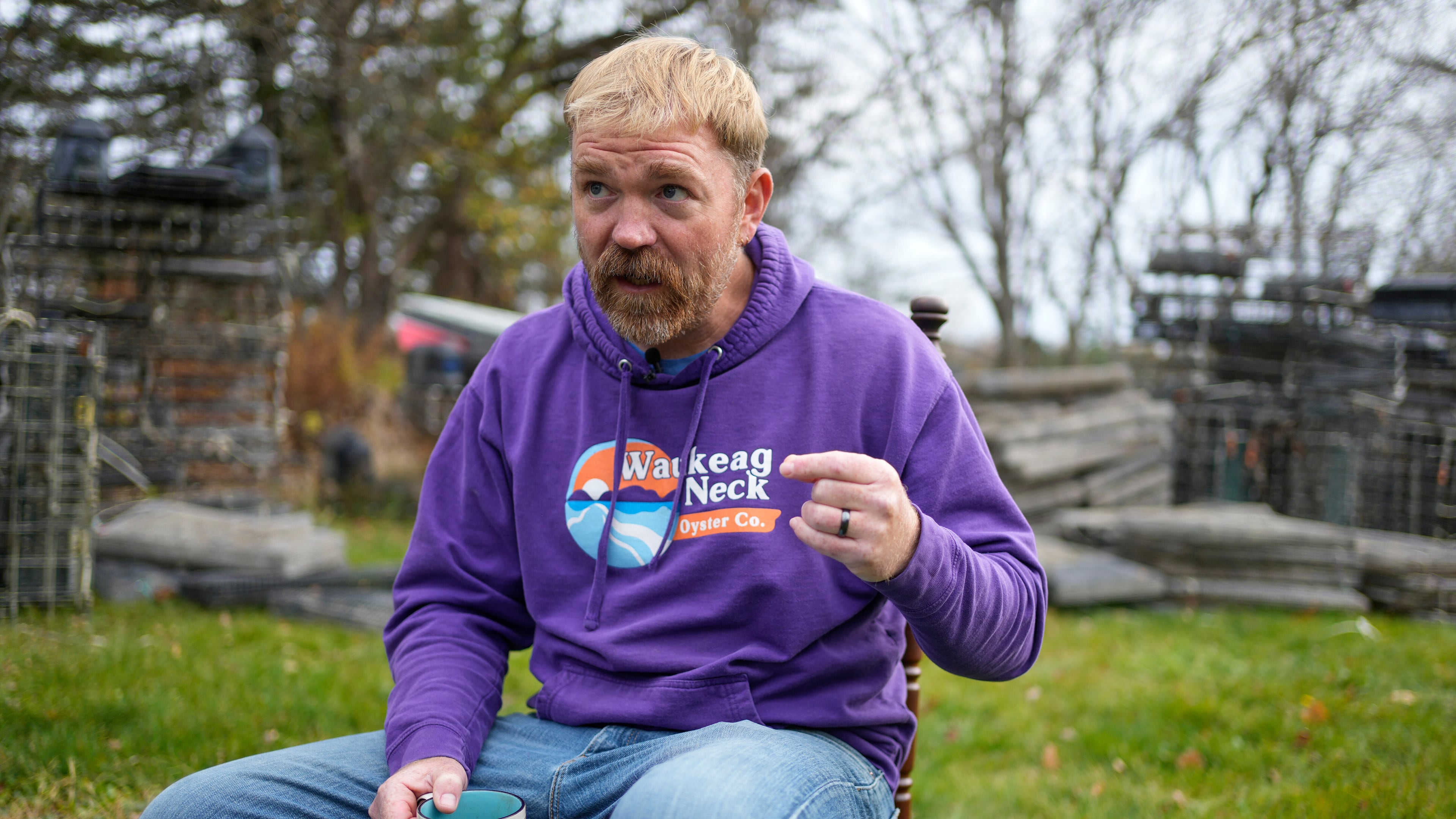 Graham Platner, Democratic candidate for U.S. Senate, speaks to a reporter at his home, Monday, Nov. 3, 2025, in Sullivan, Maine. (AP Photo/Robert F. Bukaty)