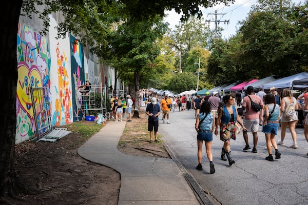 Local artists create murals live at the 11th annual Forward Warrior festival in the Cabbagetown neighborhood of Atlanta on Saturday, Sept. 13, 2025. (Olivia Bowdoin for the AJC)