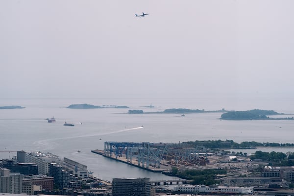Hazy skies diminish the view of the Boston Harbor Islands, Wednesday, June 4, 2025, in Boston, Mass. (AP Photo/Robert F. Bukaty)