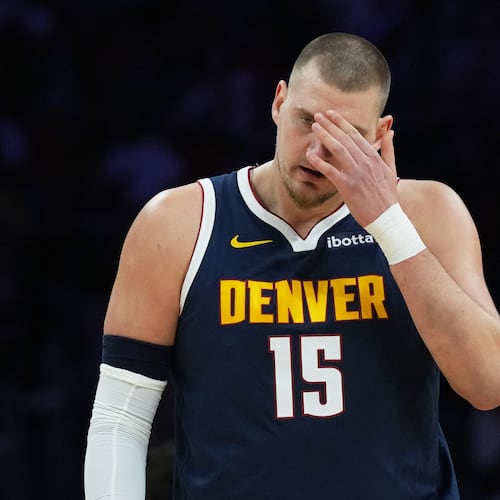 Denver Nuggets center Nikola Jokic (15) walks on the court during the first half of an NBA basketball game against the Miami Heat, Monday, Dec. 29, 2025, in Miami. (AP Photo/Lynne Sladky)