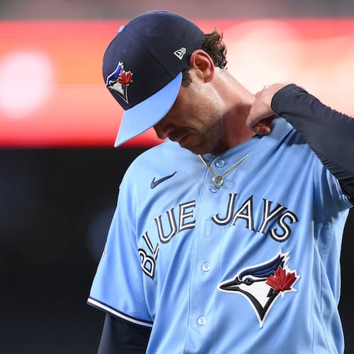 Toronto Blue Jays pitcher Shane Bieber walks back to the dugout after he was pulled from a baseball game in the first inning against the Washington Nationals, Tuesday, July 28, 2026, in Washington. (AP Photo/Nick Wass)