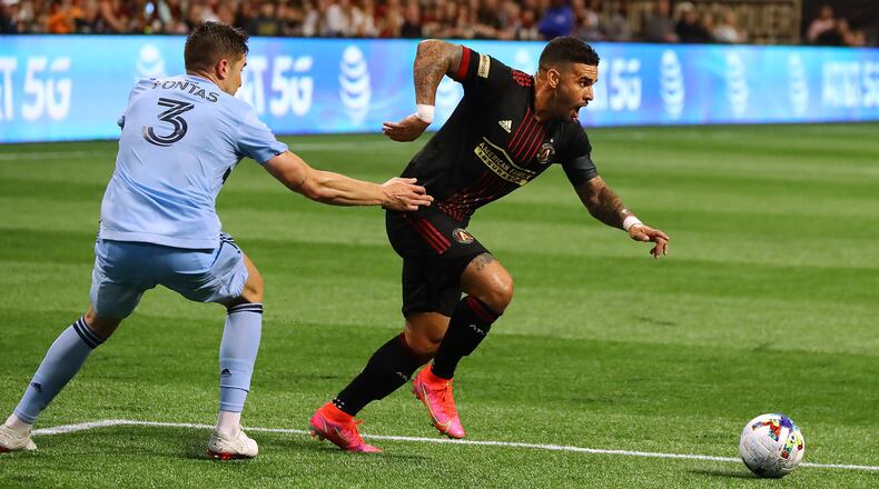 022722 : Atlanta United attacker Dom Dwyer gets past Sporting KC defender Andreu Fontas to score a goal for a 2-0 lead in a MLS soccer match on Sunday, Feb. 27, 2022, in Atlanta. “Curtis Compton / Curtis.Compton@ajc.com”`