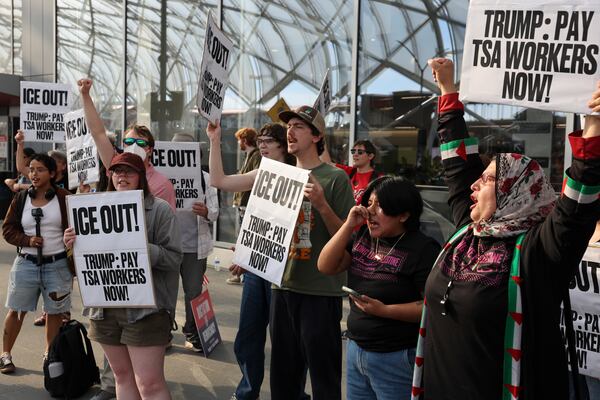 Demonstrators chant during a protest against Immigration and Customs Enforcement on Monday, March 23, 2026, at Hartsfield-Jackson Atlanta International airport. ICE was deployed to Atlanta’s airport to support TSA starting Monday morning. (Arvin Temkar/AJC)