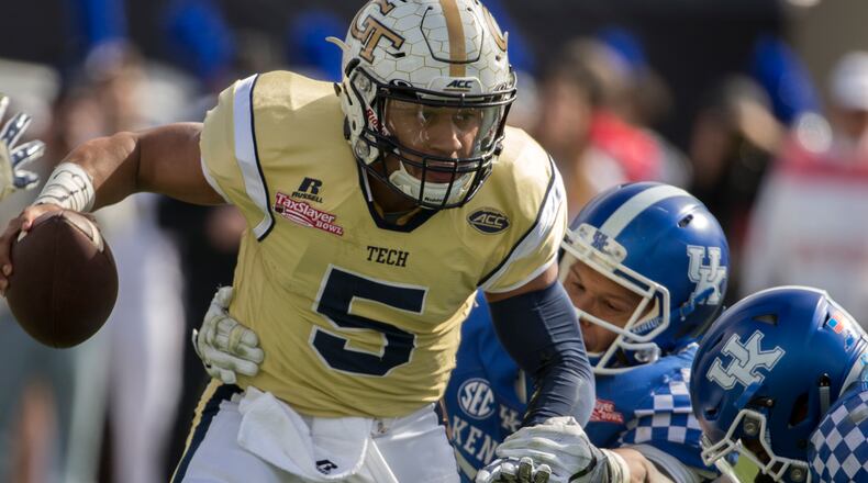 Georgia Tech quarterback Justin Thomas (5) runs the ball against during the first half of the TaxSlayer Bowl NCAA college football game against Kentucky, Saturday, Dec. 31, 2016, in Jacksonville, Fla. (AP Photo/Stephen B. Morton)