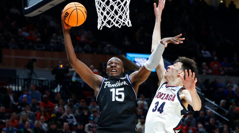 Georgia State forward Ja'Heim Hudson (15) eyes the basket in front of Gonzaga center Chet Holmgren (34) during the first half of a first round NCAA college basketball tournament game, Thursday, March 17, 2022, in Portland, Ore.  Hudson is one of the talented returns that the Panthers can build on for nexst season. (AP Photo/Craig Mitchelldyer)